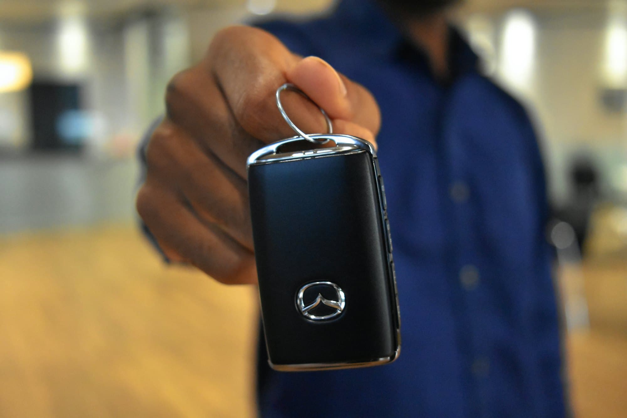 A car key being handed over